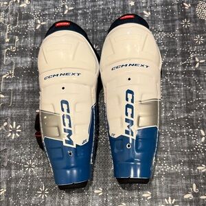 CCM Next Youth Shin Guards 9” Blue and White